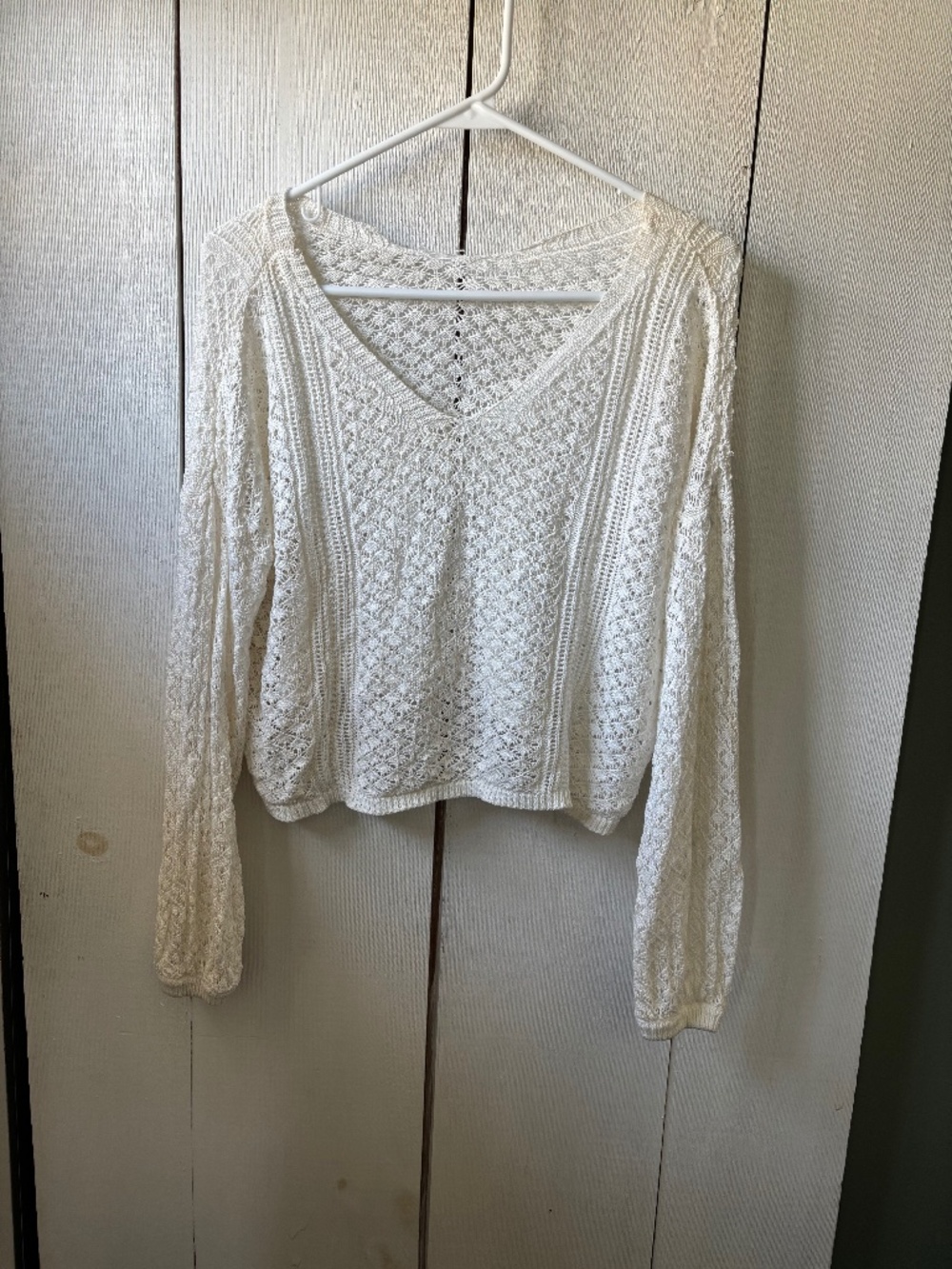 Woman’s thin sweater coverup